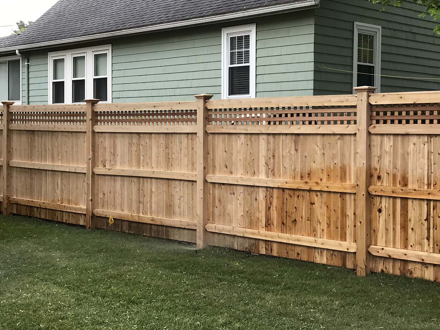 Wood Full-Privacy Fence With Lattice Top for Homes or Businesses in Tewksbury MA