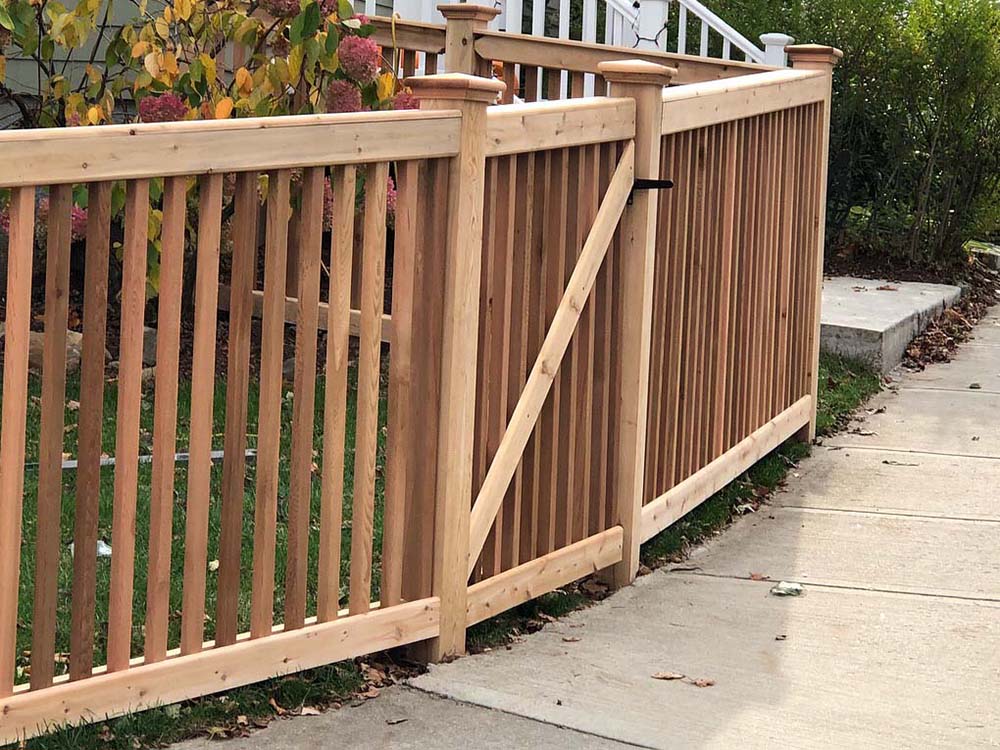 Custom Picket Wood Fence With Cap and Trim and Single Walk Gate for Homes or Businesses in Tewksbury